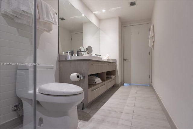 bathroom with vanity and tile patterned flooring