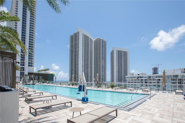 view of swimming pool featuring a patio area