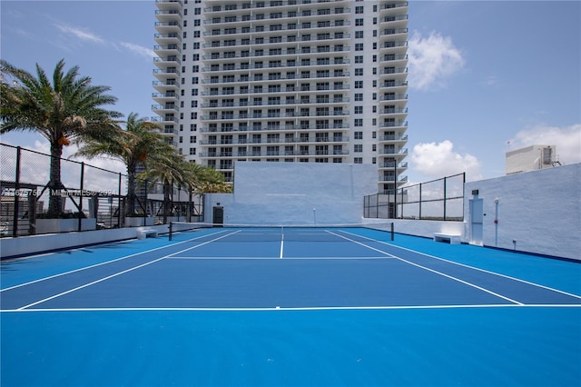 view of tennis court featuring basketball court