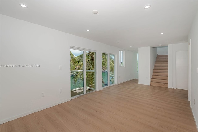 spare room featuring light wood-type flooring