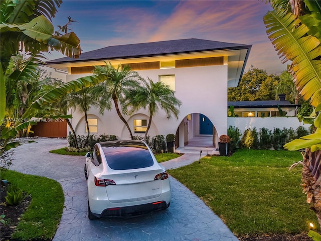 view of front of house with a yard