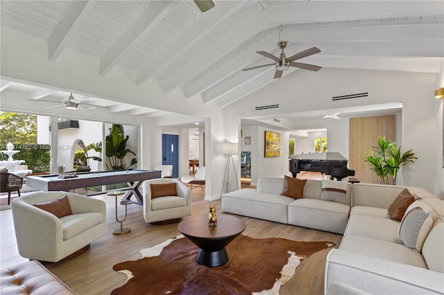 living room featuring ceiling fan, high vaulted ceiling, beamed ceiling, light hardwood / wood-style floors, and pool table