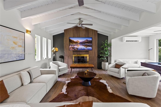 living room with vaulted ceiling with beams, plenty of natural light, dark hardwood / wood-style floors, and ceiling fan