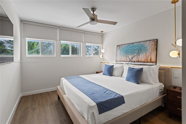 bedroom featuring dark hardwood / wood-style floors and ceiling fan