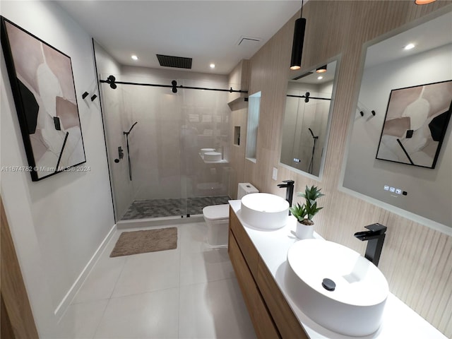 bathroom with tile patterned flooring, toilet, and a shower with shower door