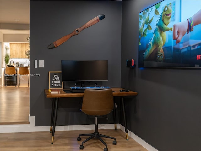 office area with wood-type flooring