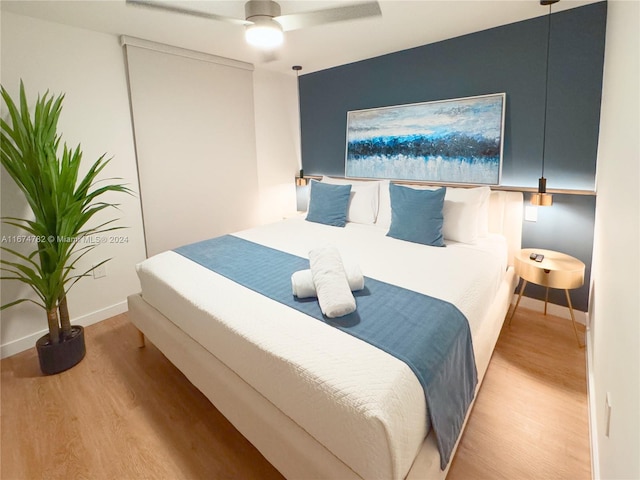 bedroom featuring ceiling fan and light wood-type flooring