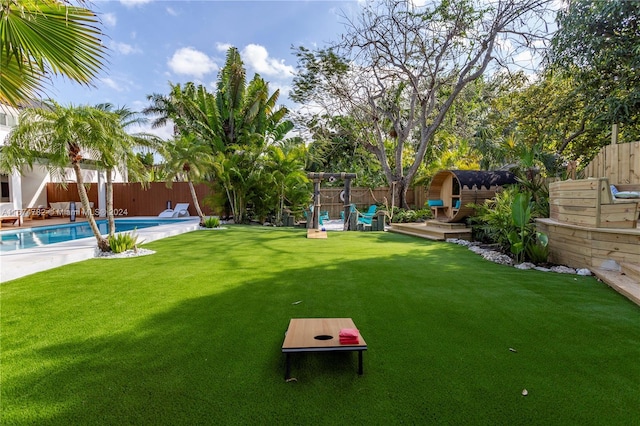 view of playground featuring a gazebo, a yard, and a patio area