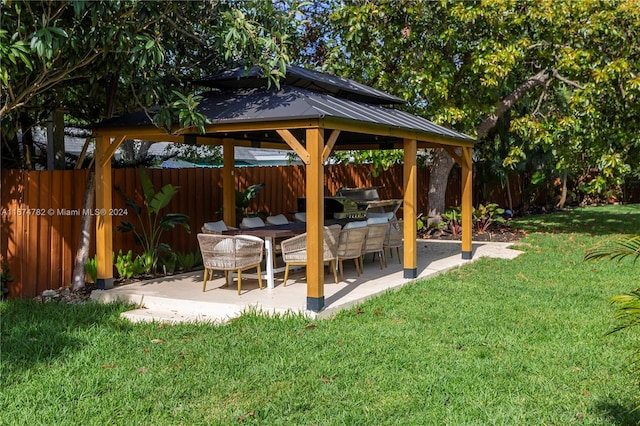 view of yard featuring a gazebo, a patio, and exterior kitchen