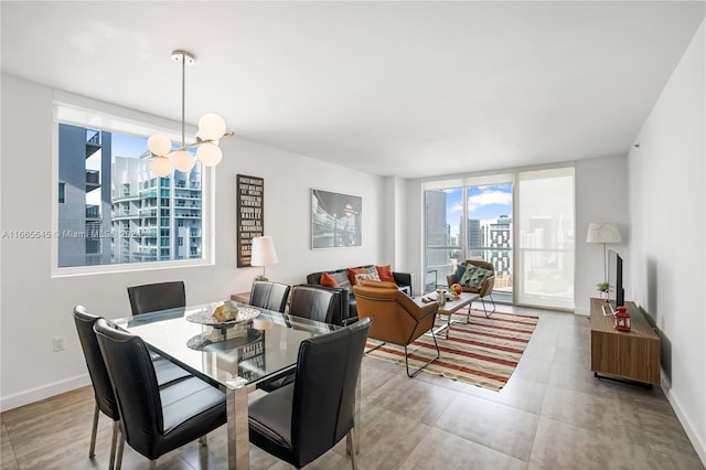 500 Brickell Ave Unit 3907, Miami, FL 33131 - dining area featuring baseboards and a chandelier