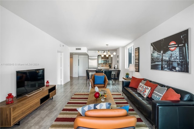 living room featuring an inviting chandelier