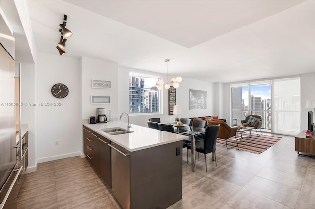 500 Brickell Ave Unit 3907, Miami, FL 33131 - kitchen with a sink, light countertops, a chandelier, and healthy amount of natural light