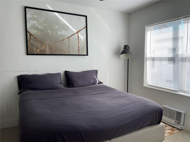 bedroom with a wall mounted air conditioner