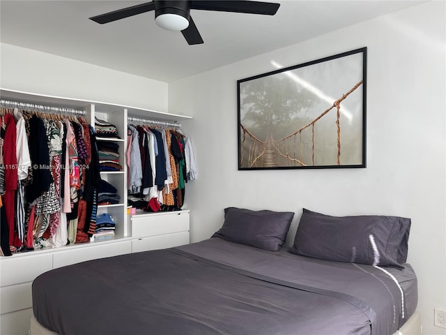 bedroom with ceiling fan and a closet