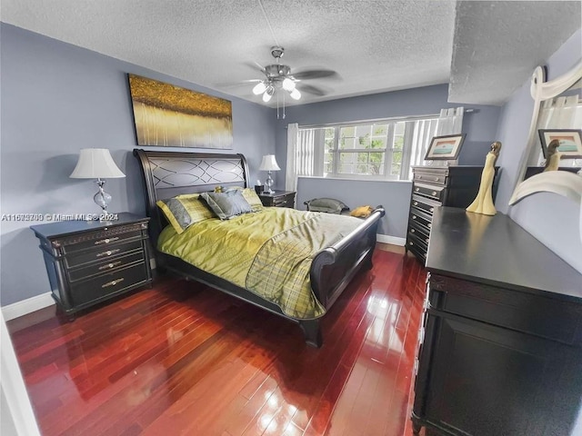 bedroom featuring ceiling fan, dark hardwood / wood-style flooring, and a textured ceiling