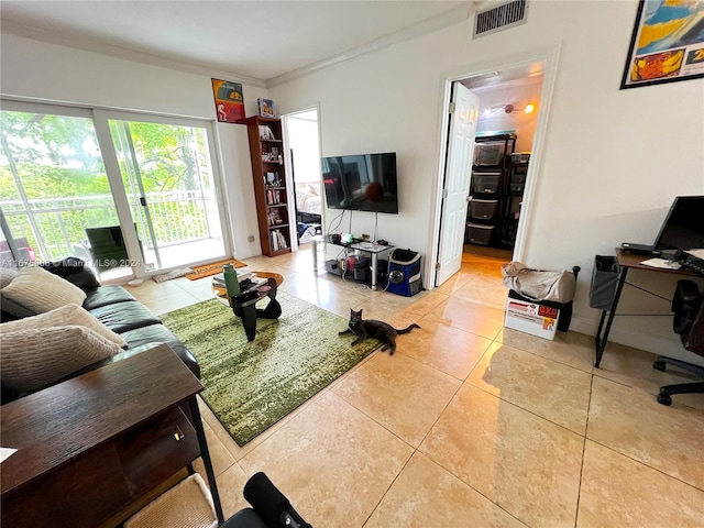 tiled living room featuring crown molding