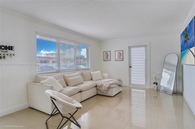 living room featuring ornamental molding and light tile patterned floors