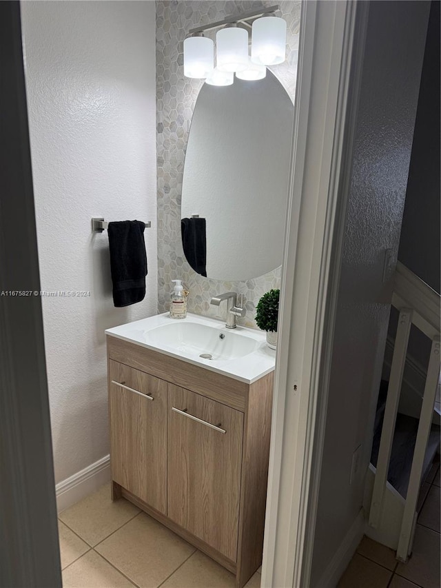 bathroom featuring vanity, decorative backsplash, and tile patterned flooring