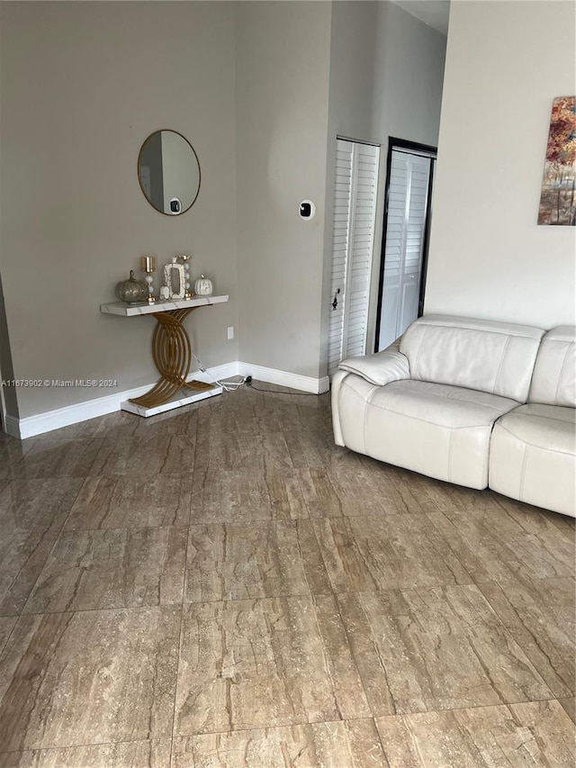 unfurnished living room featuring hardwood / wood-style flooring