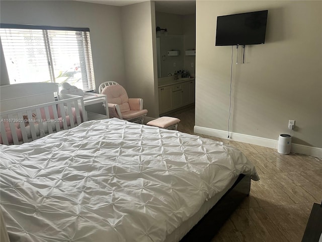 bedroom featuring connected bathroom