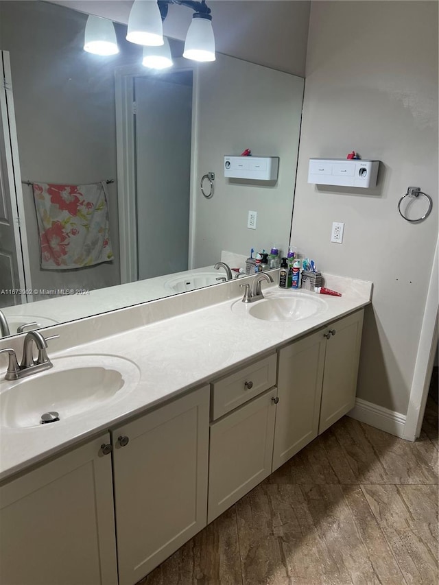 bathroom with vanity and hardwood / wood-style flooring