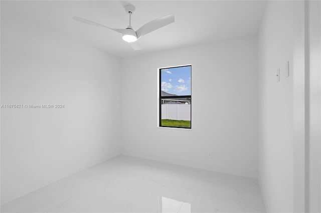 spare room with ceiling fan