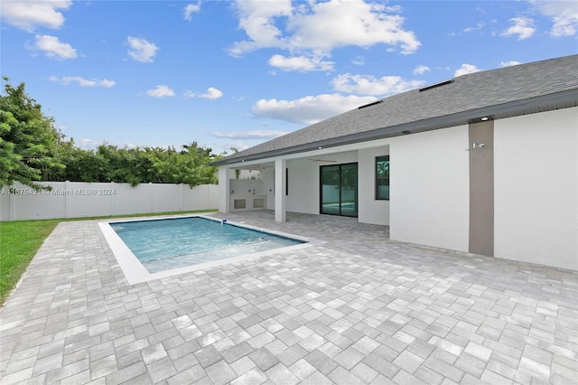 view of pool featuring a patio and ceiling fan