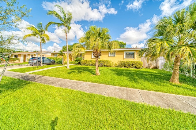 single story home featuring a front yard