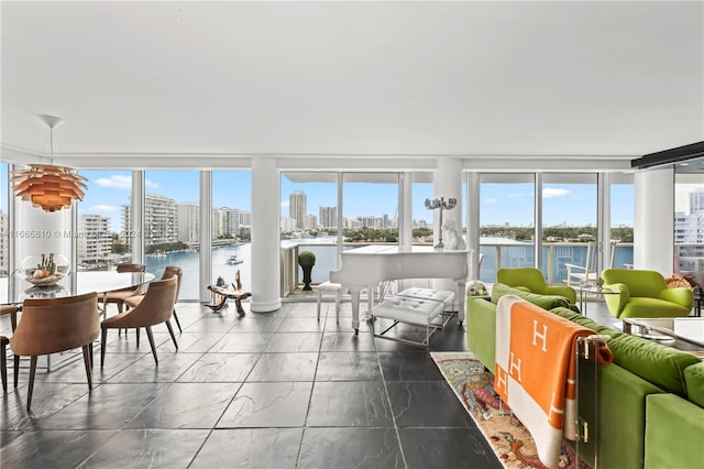 sunroom / solarium with a water view