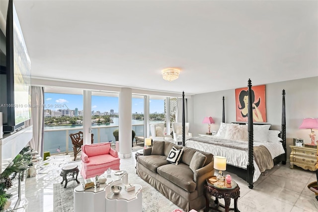 bedroom featuring a water view