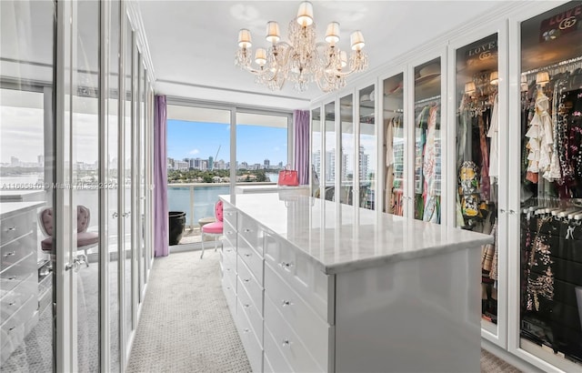 spacious closet with a notable chandelier