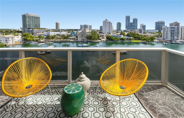 balcony featuring a water view