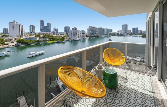 balcony featuring a water view