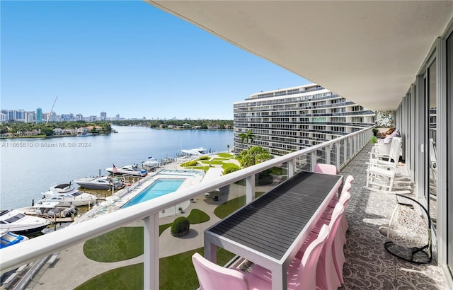 balcony featuring a water view