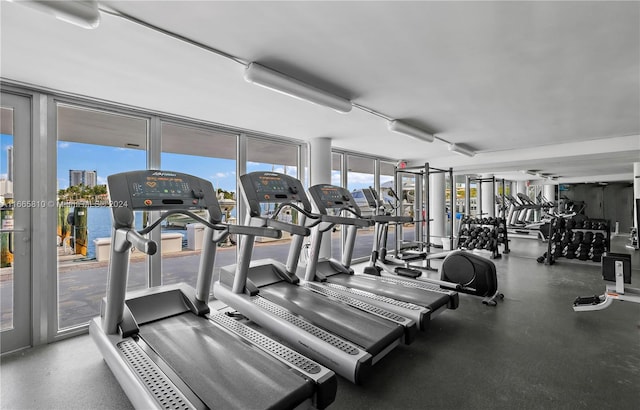 gym featuring a water view