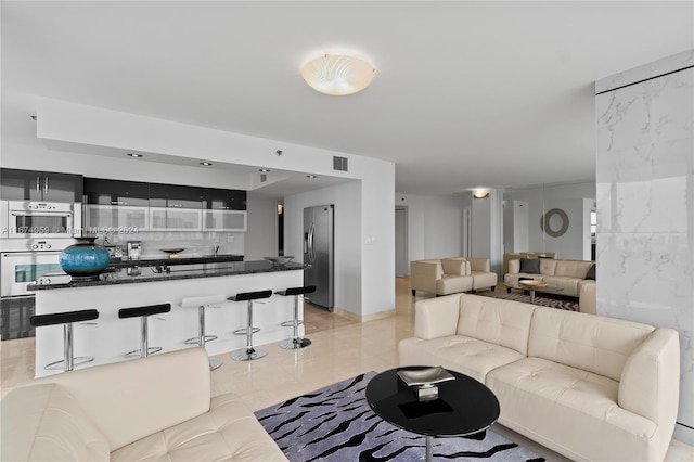 living room with light tile patterned floors