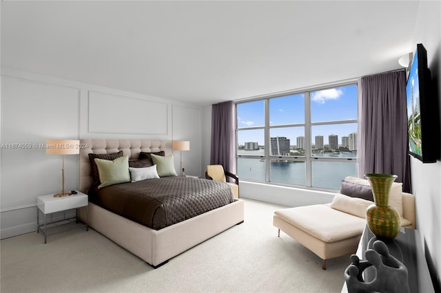 bedroom featuring light colored carpet