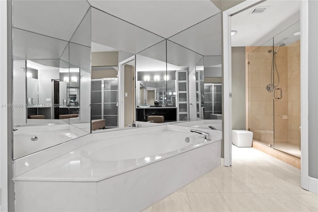 bathroom featuring tile patterned flooring, vanity, and independent shower and bath