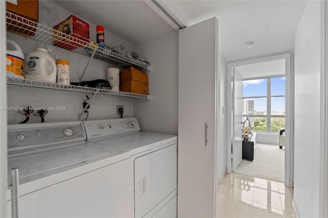 washroom with independent washer and dryer