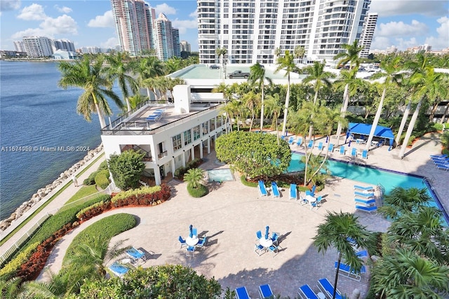 birds eye view of property with a water view