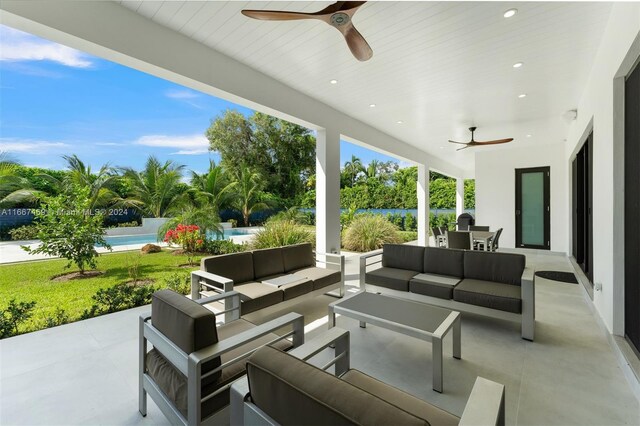 view of patio with an outdoor hangout area, a swimming pool, and ceiling fan