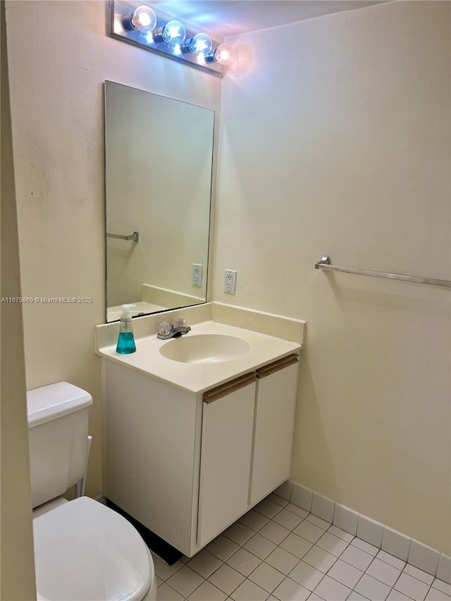 bathroom with tile patterned floors, toilet, and vanity