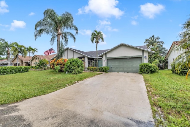 view of front of property featuring a front lawn and a garage