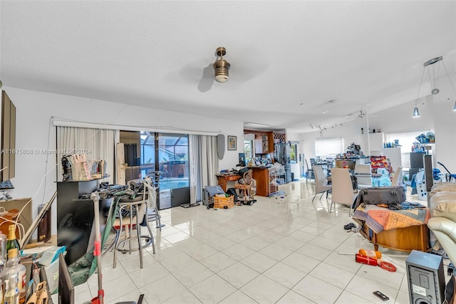 living room with light tile patterned flooring and ceiling fan