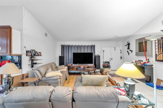 living room featuring light hardwood / wood-style flooring and lofted ceiling