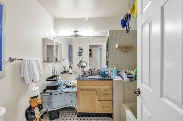 bathroom with vanity, toilet, and tile patterned floors