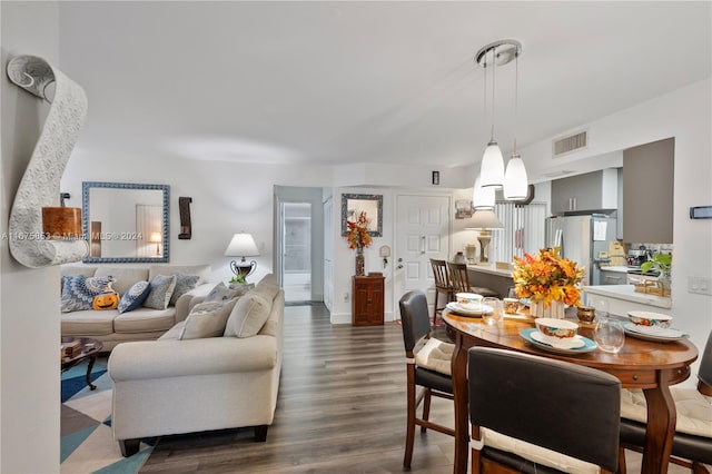 dining space featuring dark hardwood / wood-style floors