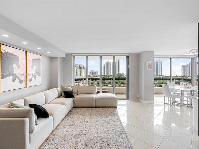 tiled living room featuring floor to ceiling windows and plenty of natural light