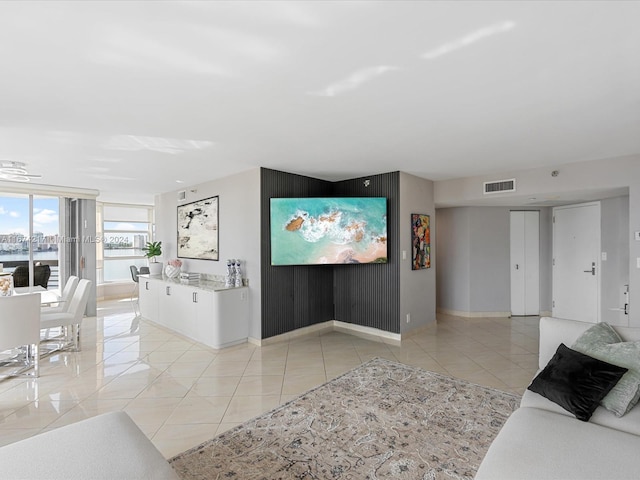 living room with light tile patterned floors