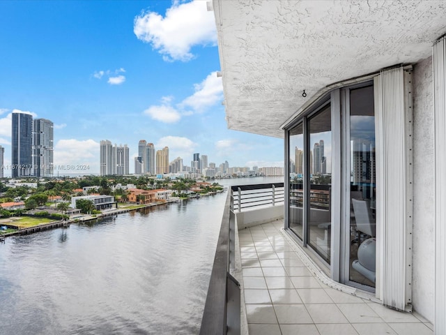 balcony featuring a water view